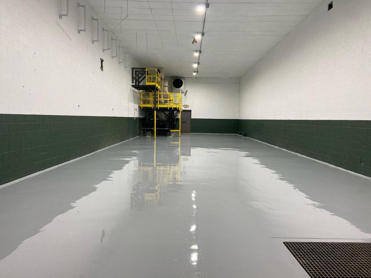 Coated manufacturing plant floor