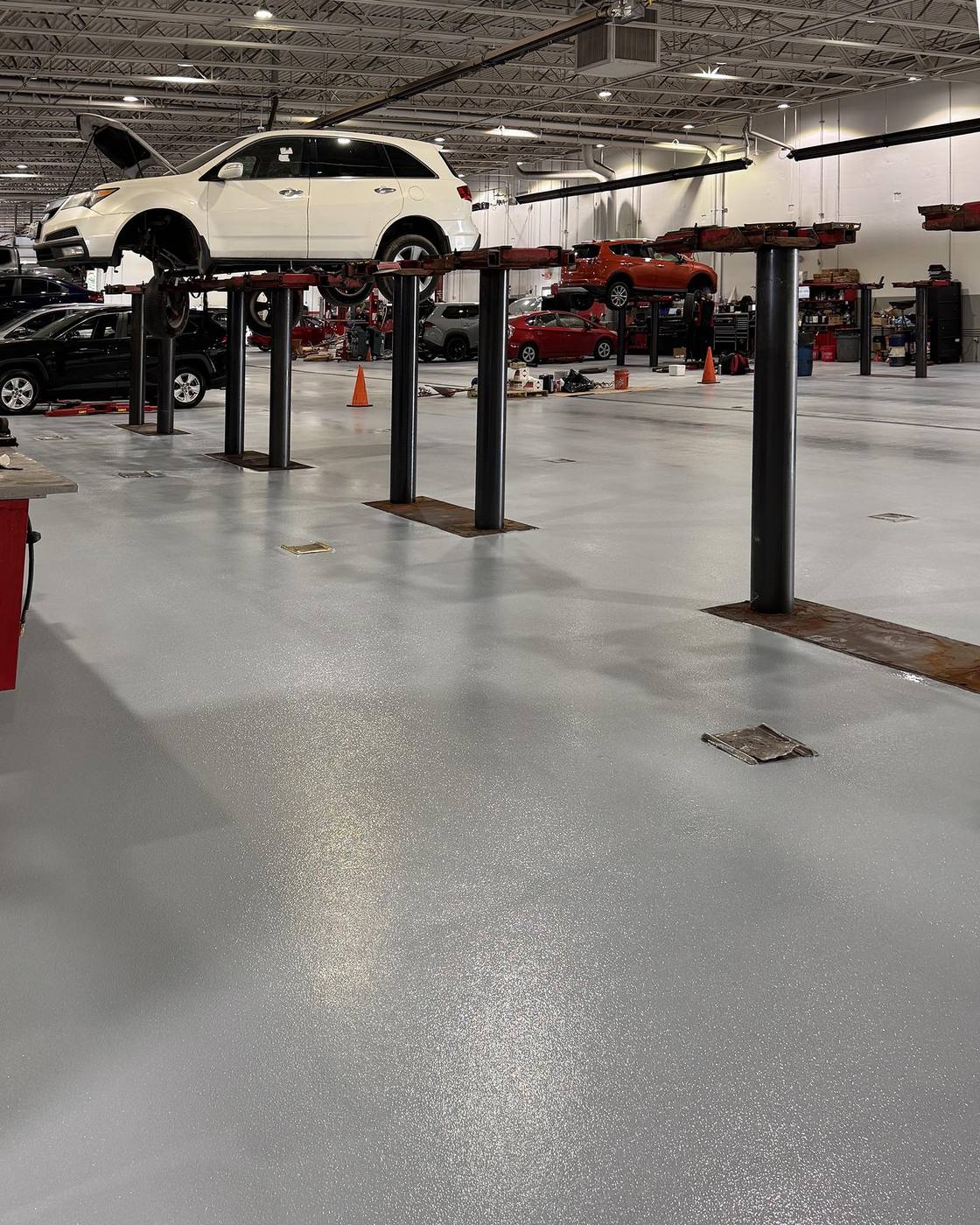 Coated dealership service bay floor