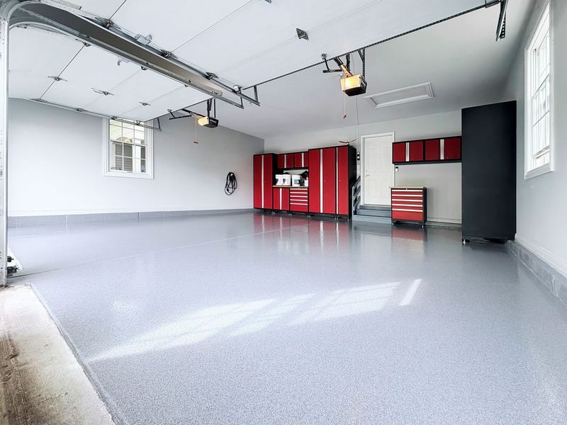 Flake garage floor with red cabinets