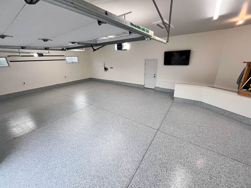 Wide view of a coated two-car garage